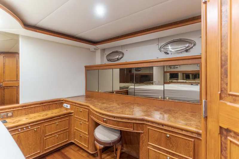 Slide: The Image of Luxurious wood interior of 1997 Forbes Cooper Pilothouse yacht with mirrored accents. - 10