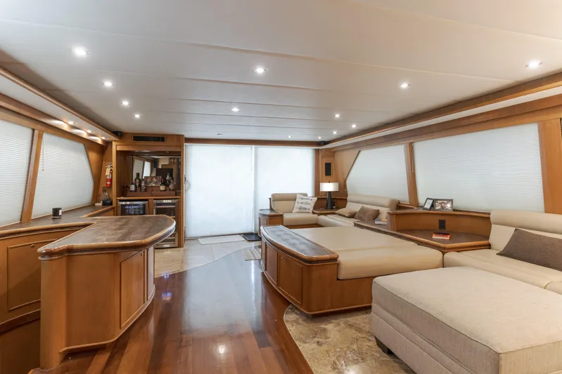 Slide: The Image of Luxurious interior of a 1997 Forbes Cooper Pilothouse yacht with elegant wood finishes. - 12
