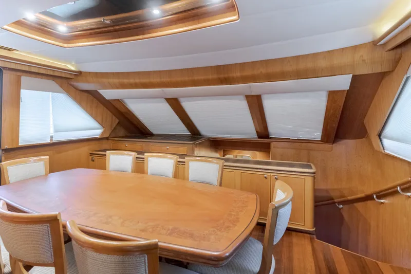 Slide: The Image of Luxurious dining area in 1997 Forbes Cooper Pilothouse yacht with wooden interior. - 17