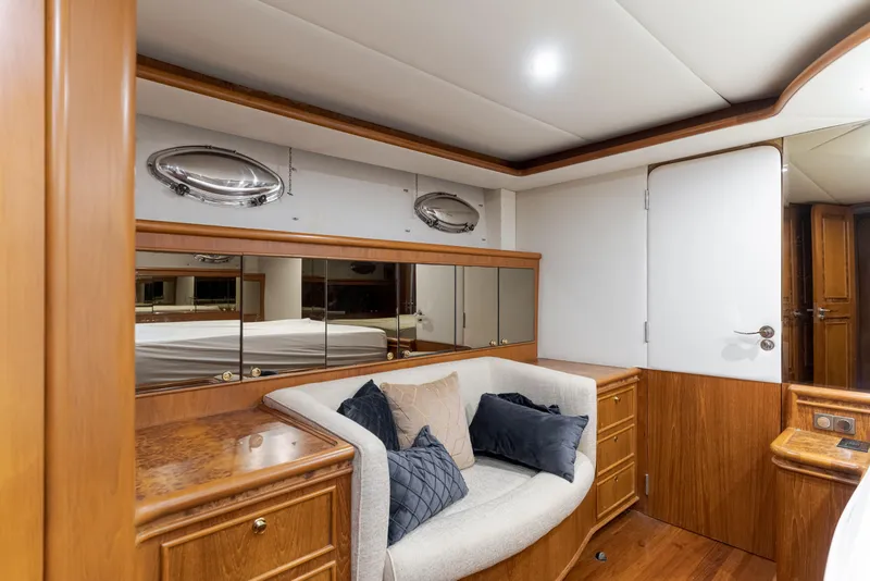 Slide: The Image of Luxurious 1997 Forbes Cooper Pilothouse yacht interior with elegant wood finish and cozy seating. - 21