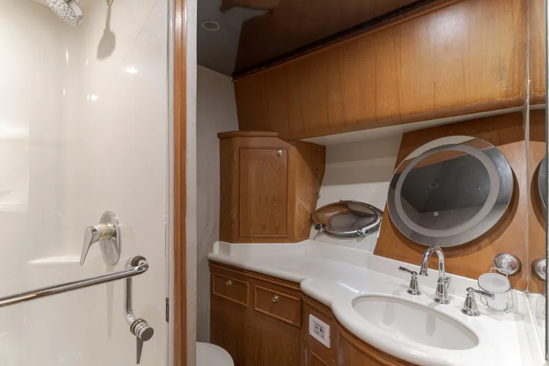 Slide: The Image of Luxurious 1997 Forbes Cooper Pilothouse yacht bathroom with wood cabinetry and modern fixtures. - 25