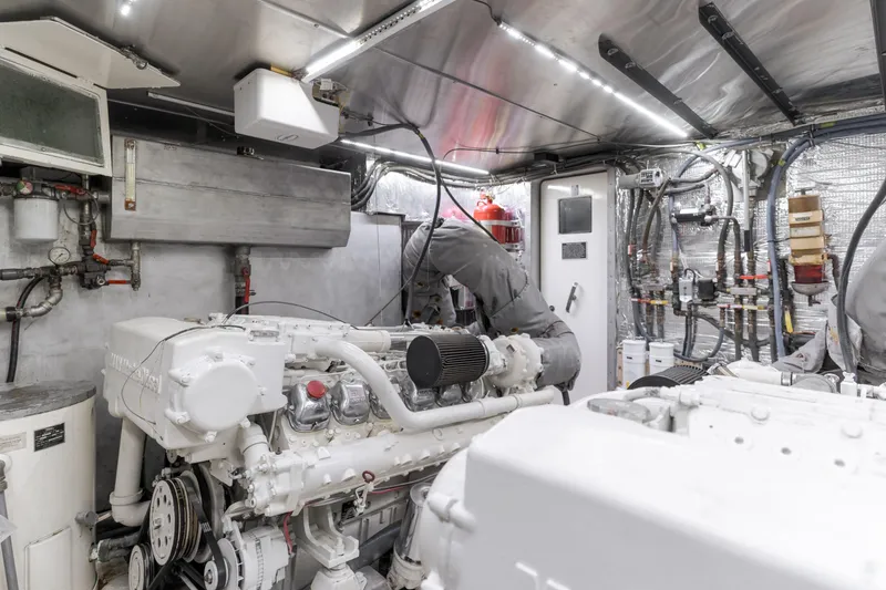 Slide: The Image of Engine room of a 1997 Forbes Cooper Pilothouse yacht, showcasing machinery and equipment. - 31