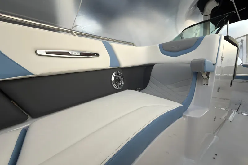 Slide: The Image of 2022 Chaparral 287 SSX boat interior with sleek seating and modern design. - 12