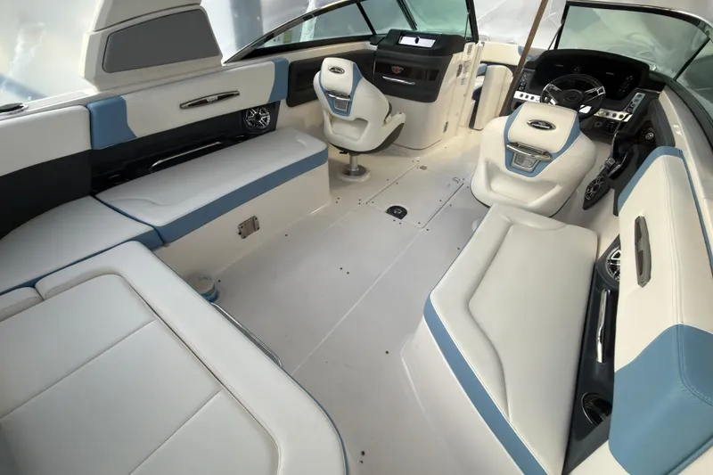 Slide: The Image of Luxurious interior of 2022 Chaparral 287 SSX boat with plush seating and modern dashboard. - 14