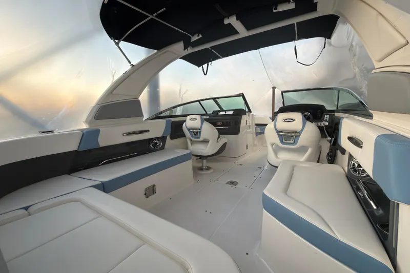 Slide: The Image of 2022 Chaparral 287 SSX boat interior with modern seating and dashboard design. - 15