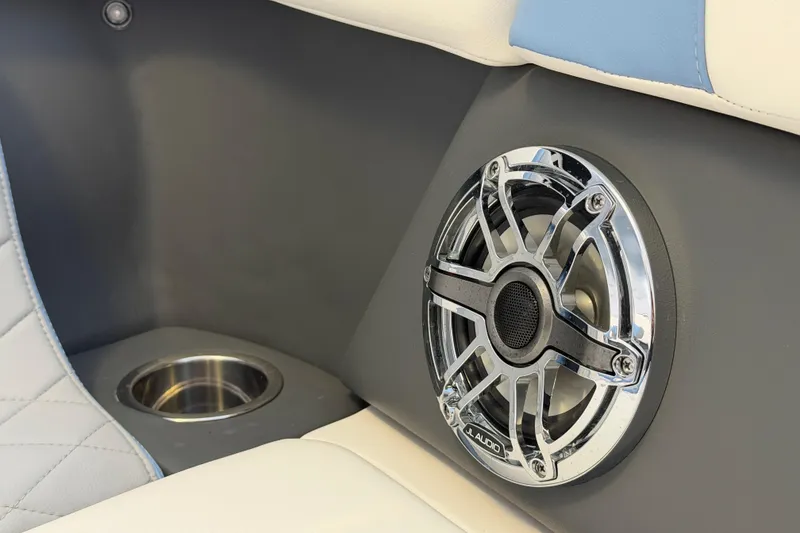Slide: The Image of 2022 Chaparral 287 SSX boat interior with JL Audio speaker and cup holder. - 22