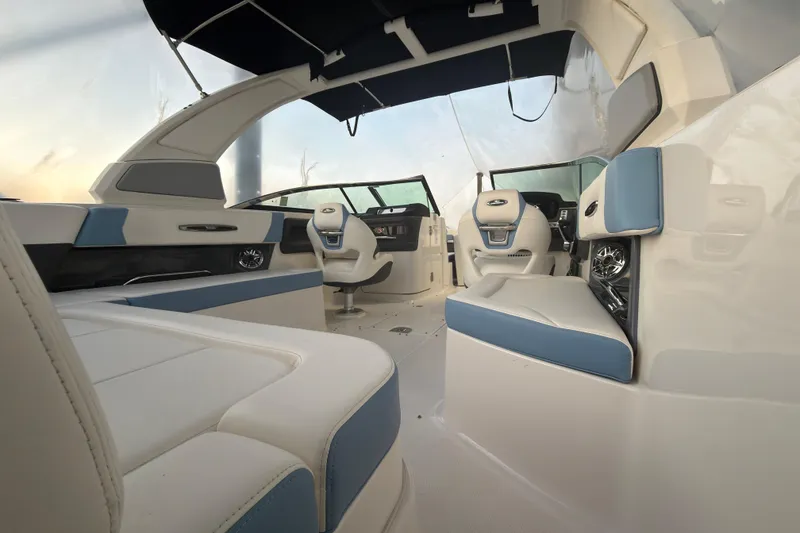 Slide: The Image of 2022 Chaparral 287 SSX boat interior with luxurious seating and modern design. - 24