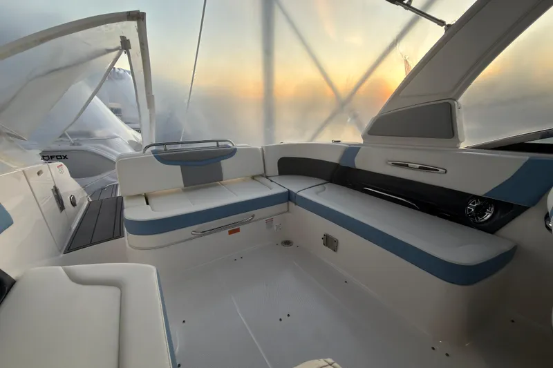 Slide: The Image of 2022 Chaparral 287 SSX boat interior with elegant seating and modern design. - 7
