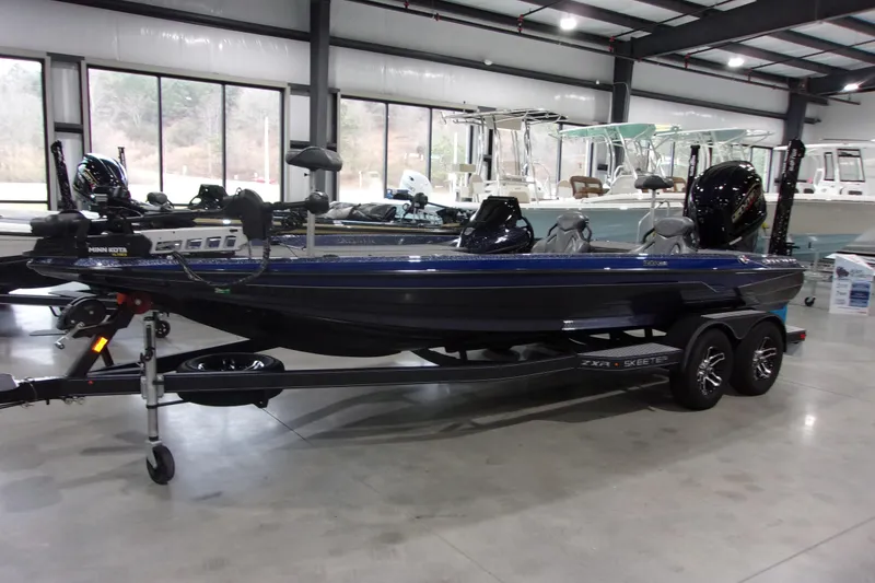 The Image of 2020 Skeeter ZXR21 bass boat in showroom, featuring dual motors and sleek design. - 1