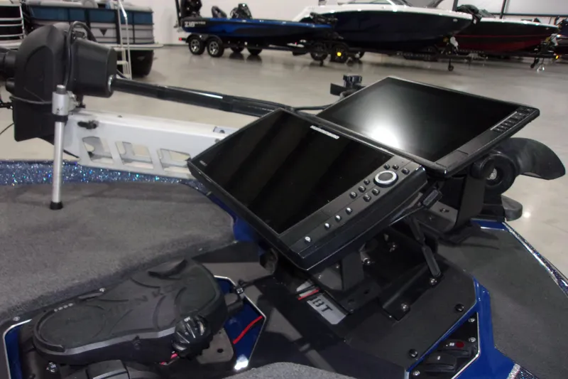 Slide: The Image of 2020 Skeeter ZXR21 boat dashboard with advanced navigation screens and controls. - 11