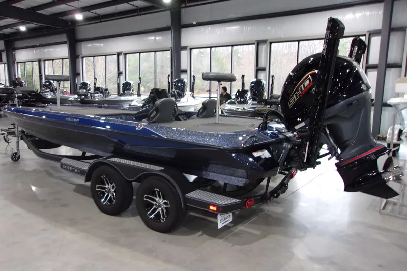 Slide: The Image of 2020 Skeeter ZXR21 boat in showroom, featuring sleek design and powerful engine. - 3