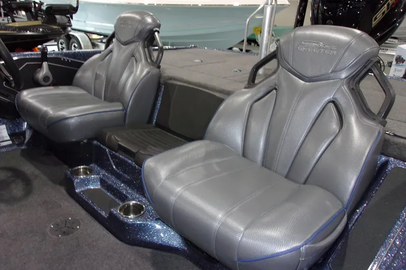 Slide: The Image of 2020 Skeeter ZXR21 boat interior with gray leather seats and cup holders. - 4