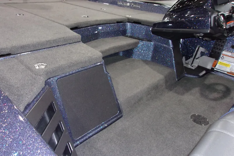 Slide: The Image of Interior of a 2020 Skeeter ZXR21 boat with carpeted flooring and sleek design. - 5