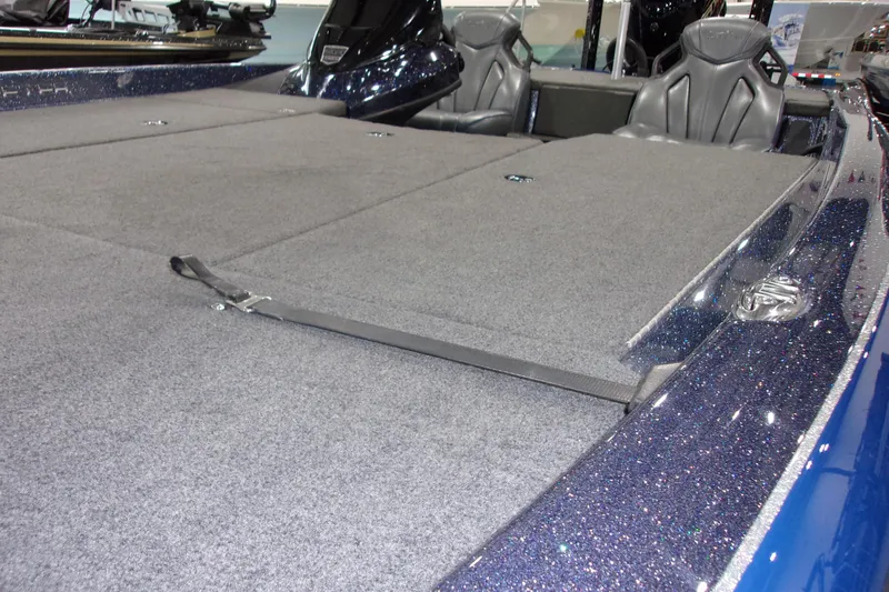 Slide: The Image of 2020 Skeeter ZXR21 boat interior with gray carpet and seating. - 8