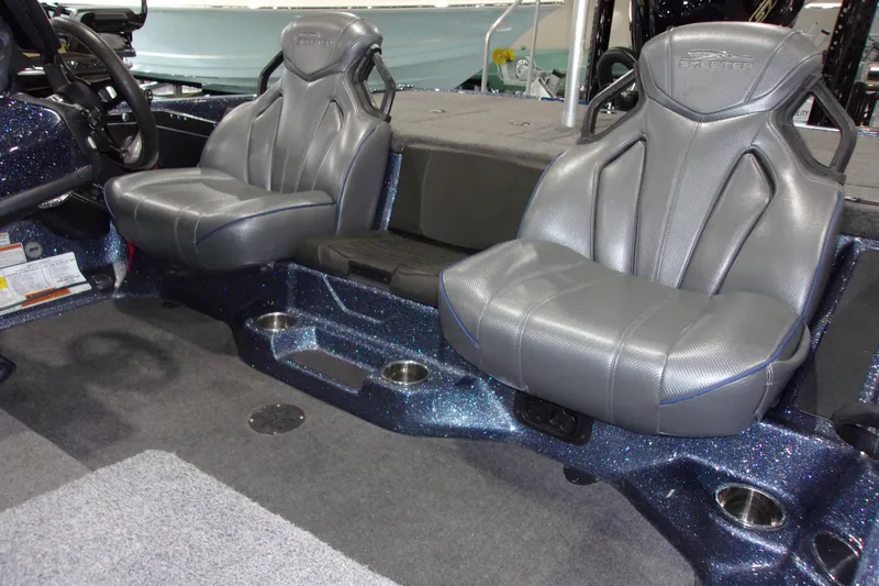 Slide: The Image of 2020 Skeeter ZXR21 boat interior with gray leather seats and sparkling blue accents. - 9