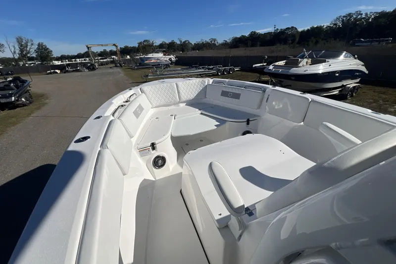 Slide: The Image of 2026 Sea Fox 268 Commander boat interior with seating and storage, displayed outdoors. - 4