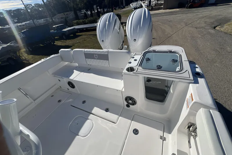 Slide: The Image of 2026 Sea Fox 268 Commander boat deck with dual engines and seating area. - 6
