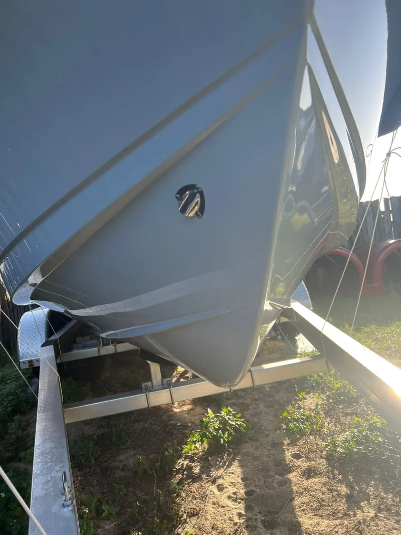 Slide: The Image of 2022 Sea Hunt Ultra 229 boat on trailer, side view. - 5