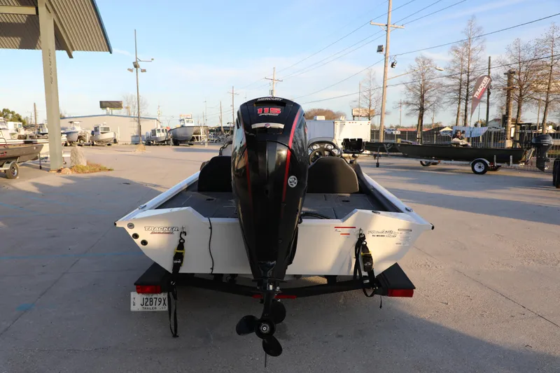 Slide: The Image of 2024 Bass Tracker PRO TEAM 190 boat with Mercury engine, parked outdoors on a trailer. - 3