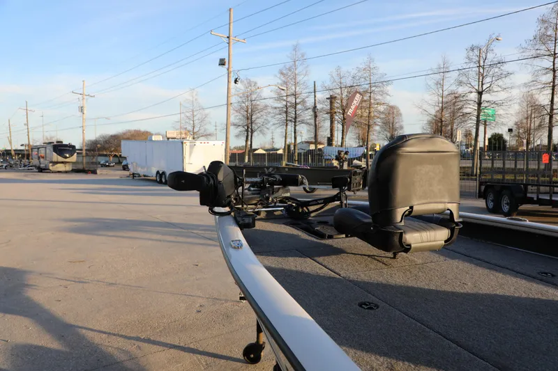 Slide: The Image of 2024 Bass Tracker PRO TEAM 190 boat on display in outdoor lot. - 5