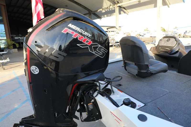 Slide: The Image of 2024 Bass Tracker PRO TEAM 190 with Mercury PRO XS 115 engine, docked under a canopy. - 9