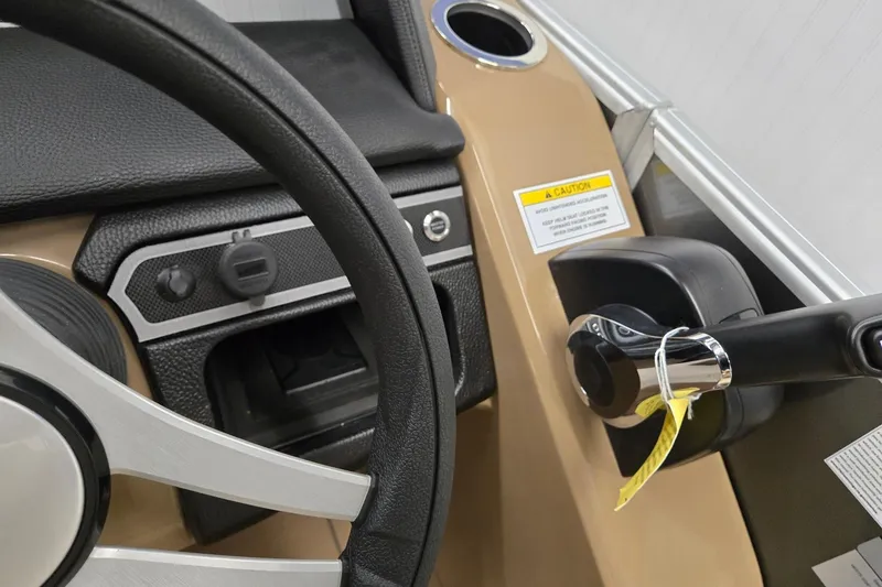 Slide: The Image of Steering wheel and controls of 2026 Godfrey Monaco 215 C boat interior. - 11