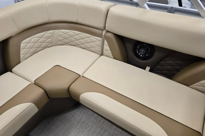 Slide: The Image of Luxurious seating in 2026 Godfrey Monaco 215 C boat, featuring beige and brown upholstery. - 15