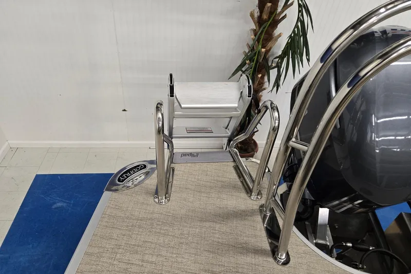 Slide: The Image of 2026 Godfrey Monaco 215 C boat ladder and deck with chrome railing. - 17