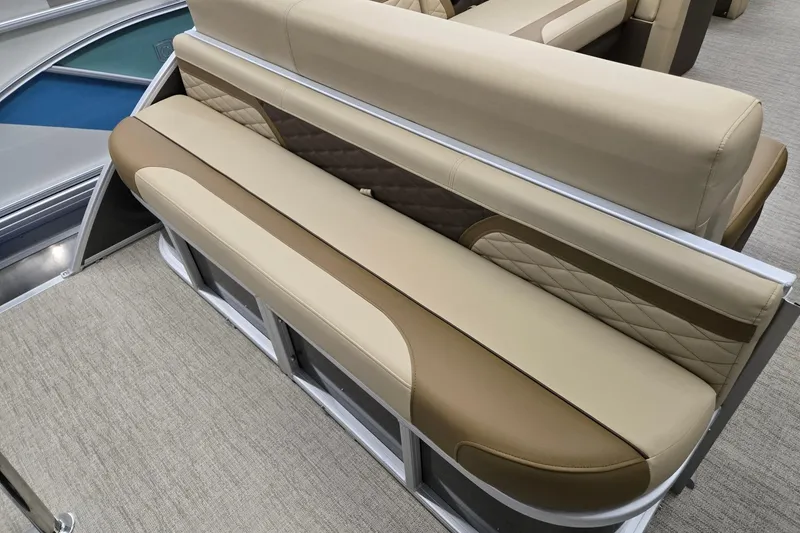 Slide: The Image of 2026 Godfrey Monaco 215 C boat interior with beige and brown seating. - 18
