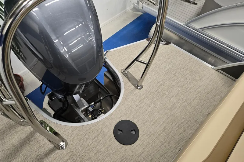 Slide: The Image of 2026 Godfrey Monaco 215 C boat engine area with stainless steel railings. - 19