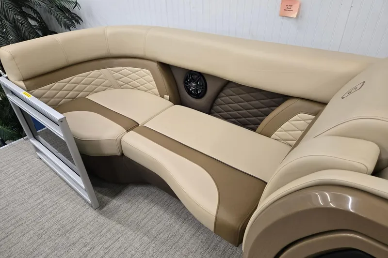 Slide: The Image of Luxurious seating in 2026 Godfrey Monaco 215 C boat, featuring beige and brown upholstery. - 25