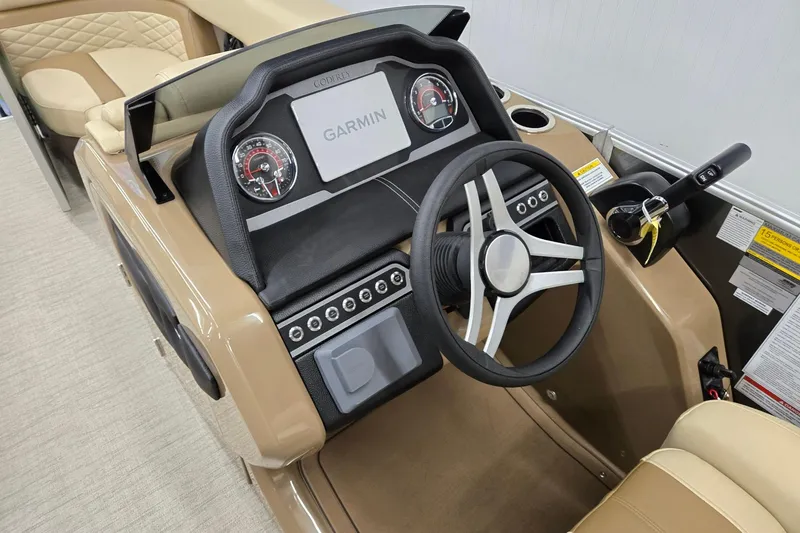 Slide: The Image of Steering console of 2026 Godfrey Monaco 215 C boat with Garmin display and controls. - 8