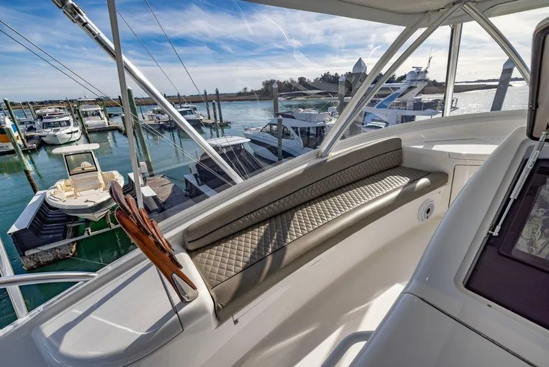 Slide: The Image of Luxurious 2022 Viking 72 Convertible yacht interior with marina view. - 20