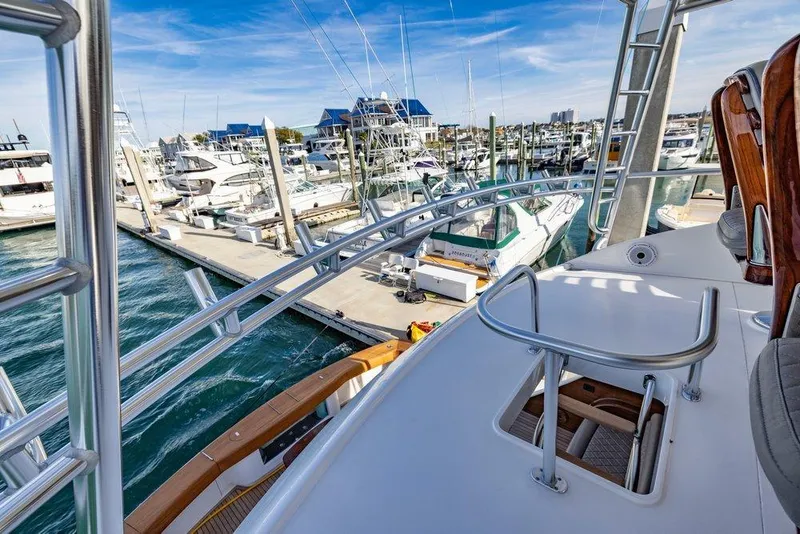 Slide: The Image of Viking 72 Convertible 2022 at marina, view from deck. - 27