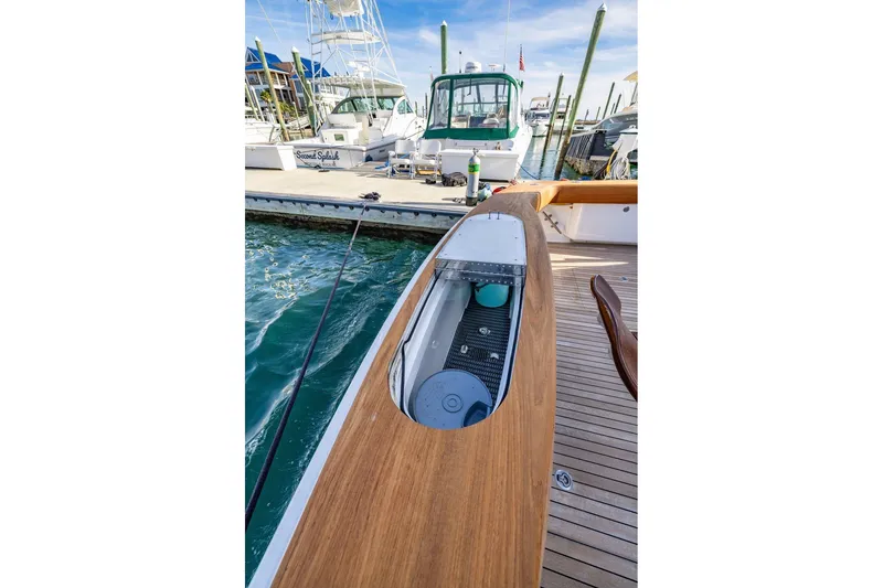 Slide: The Image of Viking 72 Convertible 2022 at dock with open storage compartment. - 31