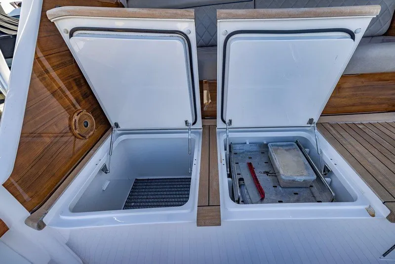Slide: The Image of Open storage compartments on 2022 Viking 72 Convertible yacht deck. - 34