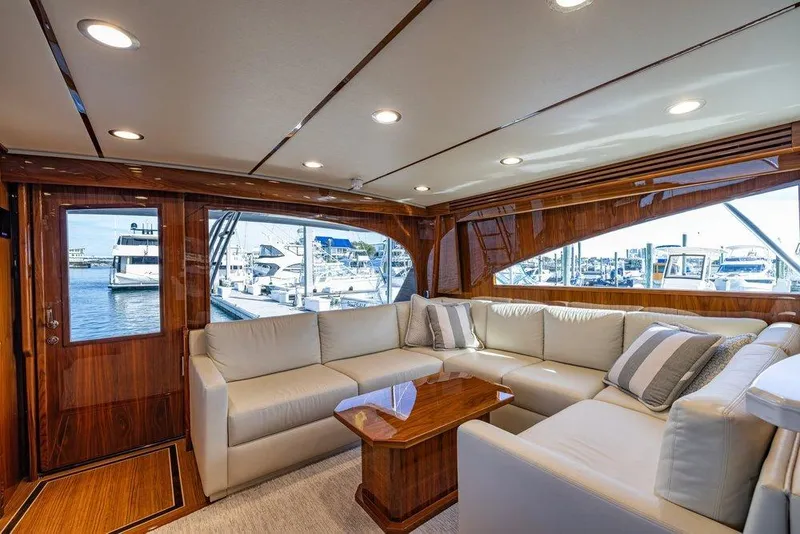 Slide: The Image of Luxurious interior of 2022 Viking 72 Convertible yacht with plush seating and elegant wood finishes. - 39