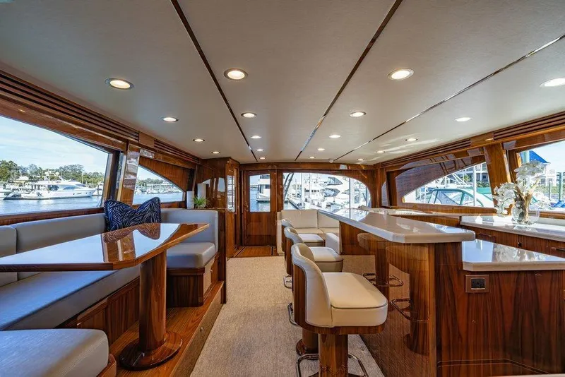 Slide: The Image of Luxurious interior of 2022 Viking 72 Convertible yacht with elegant seating and wood finishes. - 46
