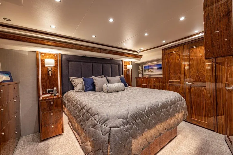 Slide: The Image of Luxurious bedroom interior of 2022 Viking 72 Convertible yacht with elegant wood finishes. - 52