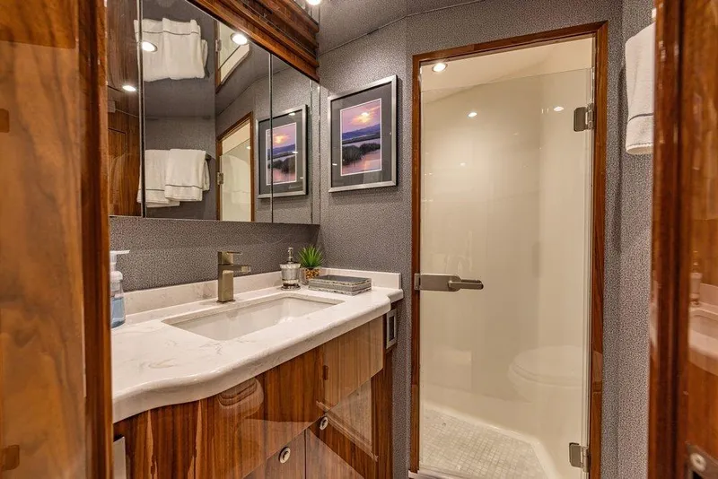 Slide: The Image of Luxurious bathroom in 2022 Viking 72 Convertible yacht with modern fixtures and elegant design. - 55