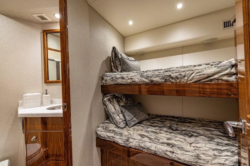 Slide: The Image of Interior of 2022 Viking 72 Convertible yacht with bunk beds and bathroom. - 61
