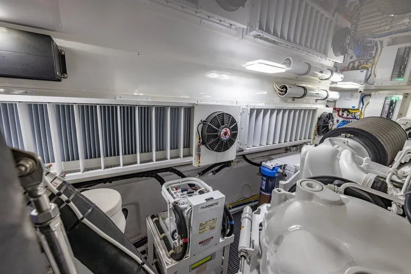 Slide: The Image of Engine room of 2022 Viking 72 Convertible yacht, showcasing advanced machinery and equipment. - 71