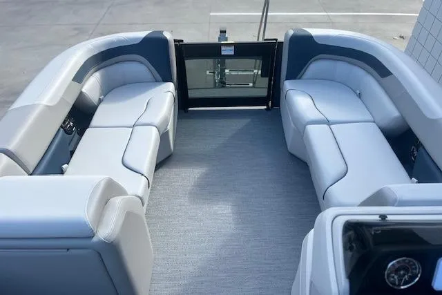 Slide: The Image of 2026 Godfrey Sweetwater 2286 SB pontoon boat interior with plush seating. - 12
