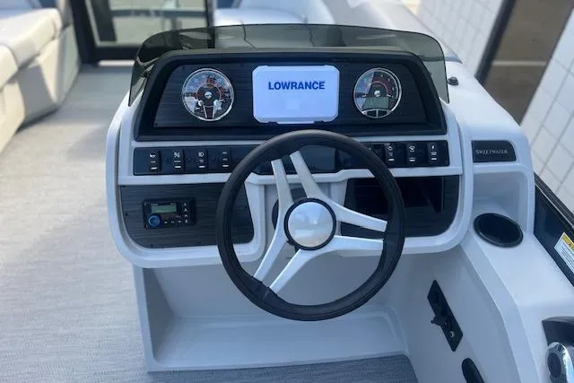 Slide: The Image of Steering console of 2026 Godfrey Sweetwater 2286 SB with Lowrance display and gauges. - 13