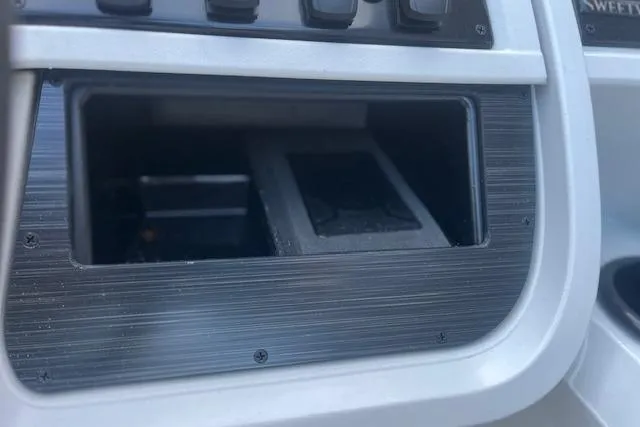 Slide: The Image of Control panel of 2026 Godfrey Sweetwater 2286 SB boat, featuring empty compartment. - 14