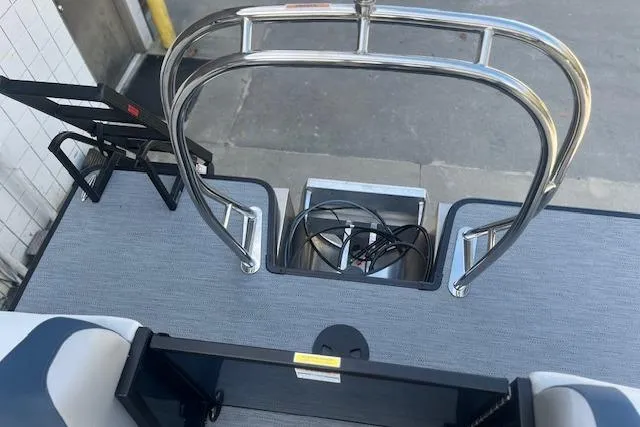 Slide: The Image of 2026 Godfrey Sweetwater 2286 SB boat deck with stainless steel railing and seating area. - 19