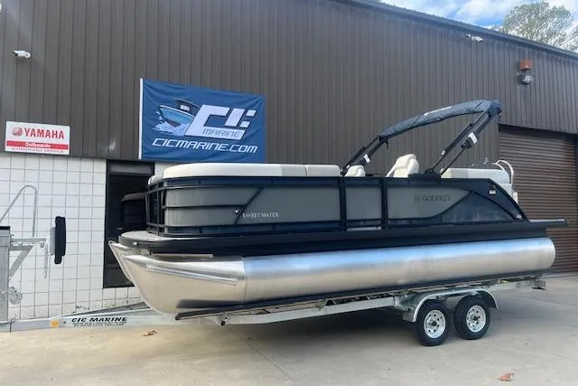 The Image of 2026 Godfrey Sweetwater 2286 SB pontoon boat on trailer at dealership. - 4