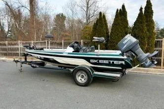 Slide: The Image of 2007 Skeeter SX170 fishing boat on trailer, parked outdoors. - 3