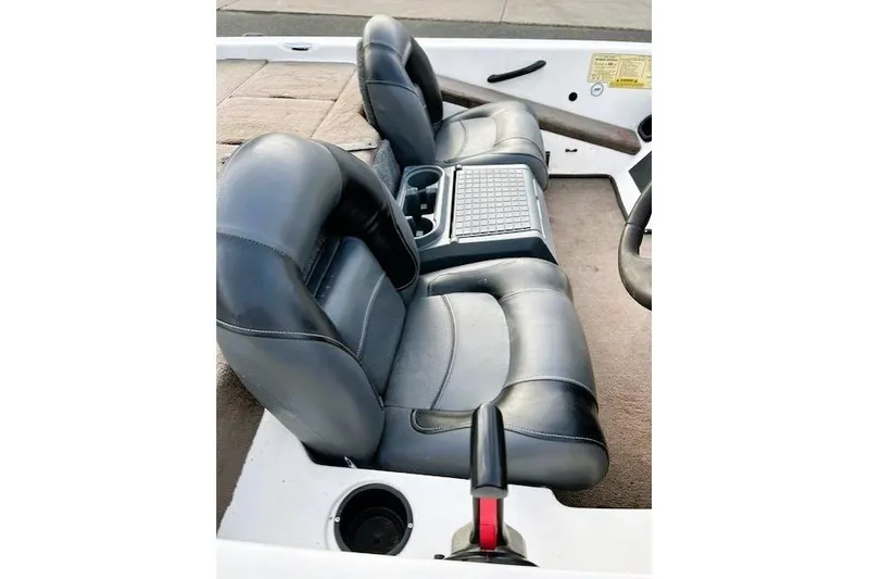 Slide: The Image of 2007 Skeeter SX170 boat interior with black leather seats and console. - 5