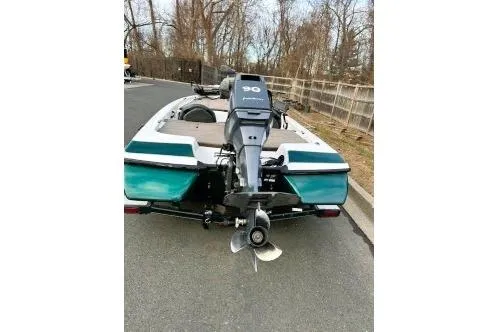 Slide: The Image of 2007 Skeeter SX170 boat with outboard motor on a road. - 9